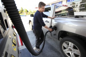 John Dato pumps gas at a 76 station in West Covina, Calif.