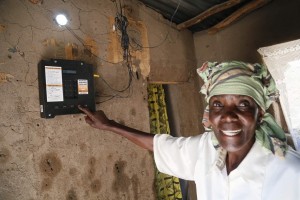 Elizabeth Mukwimba is a 62-year-old Tanzanian woman who now has solar lighting and electricity in her home at the flick of a switch, thanks to an off-grid project.  Photo from Off-Grid Electric.